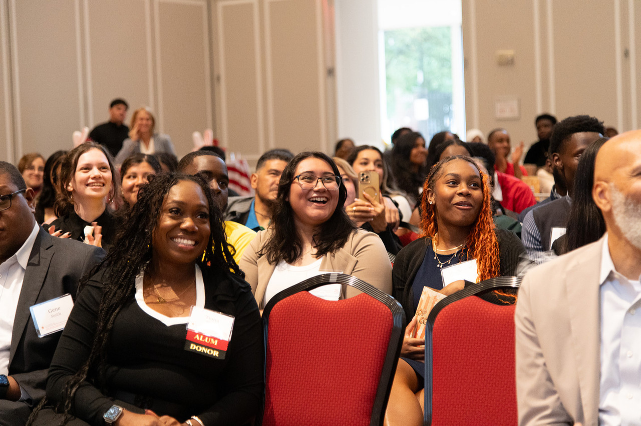 audience members smile